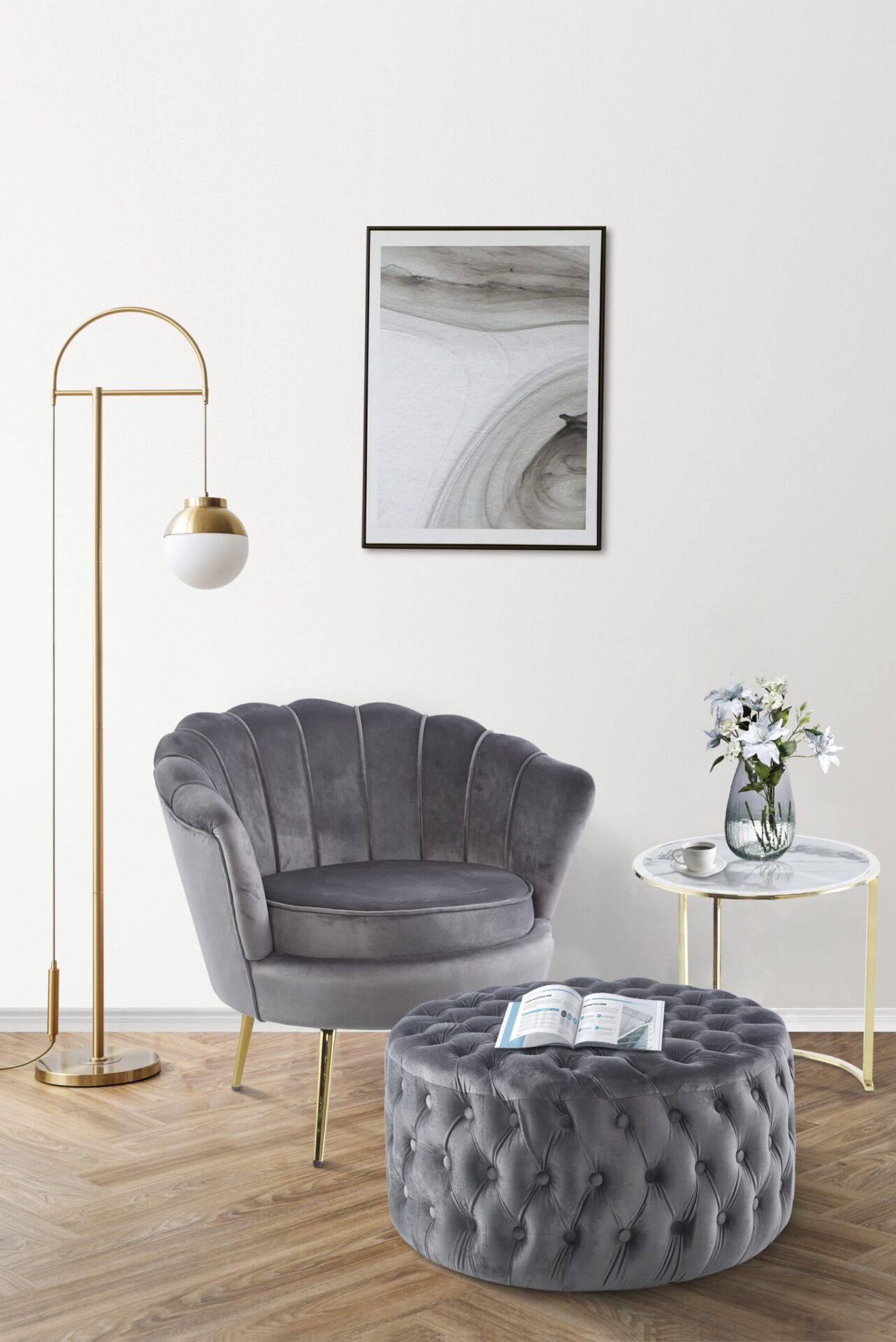 Picture frame with abstract art by a pink velvet armchair